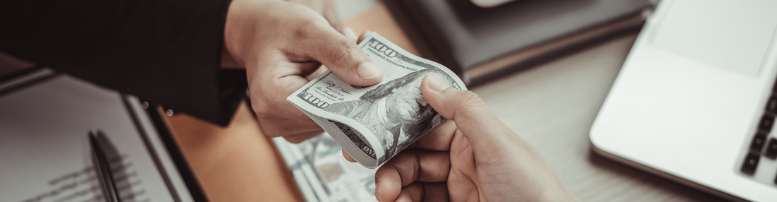 Baker's Gas Person handing another person money