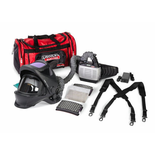 Lincoln hard hat PAPR helmet with blower unit connected with a white background. Filters and should strap sit to the right and a red duffle bag to the left.