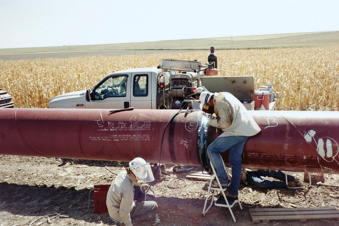 National Tradesmen Day - Welders doing some work on a Pipe