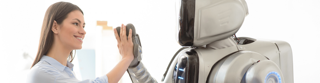 Woman and robot touching hands